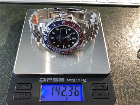 rolex submariner weight in grams